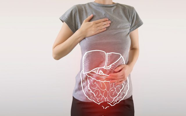 Woman arms on digestive system, stomach